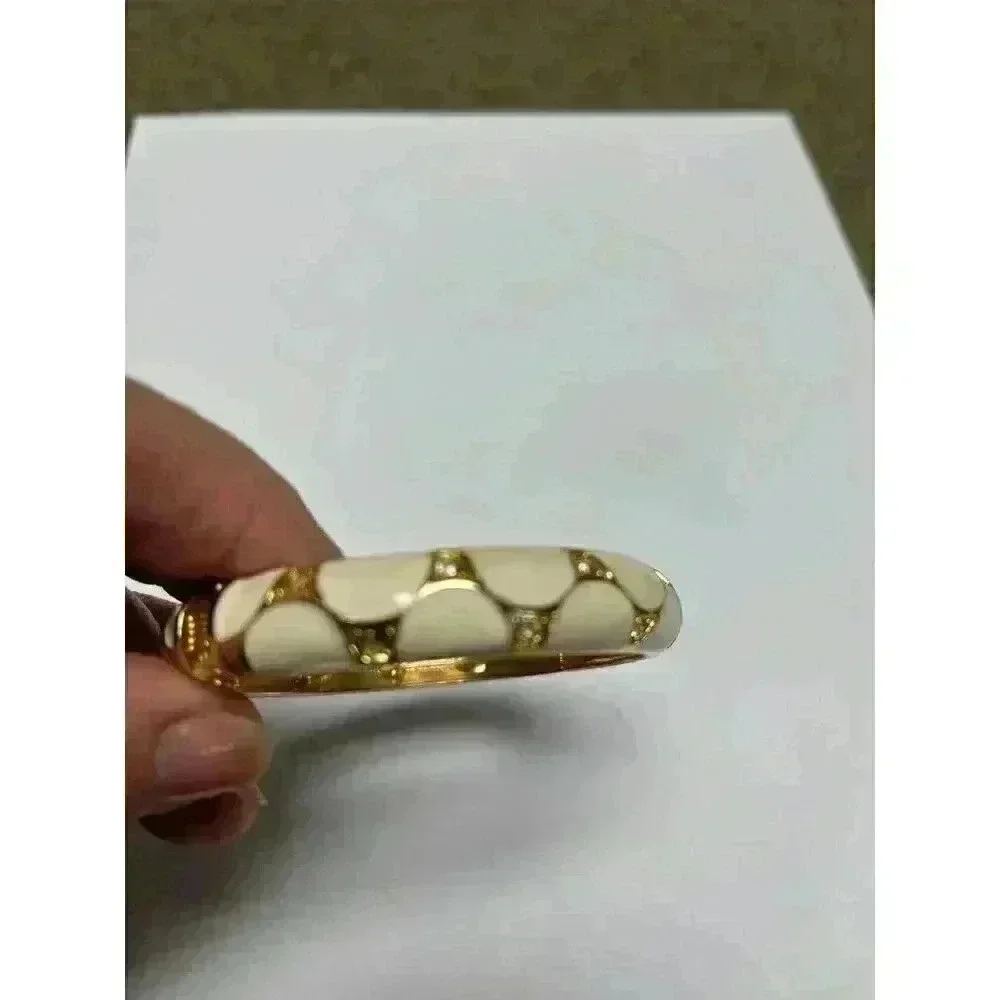 White enamel‎ bracelet with gold/rhinestone accents